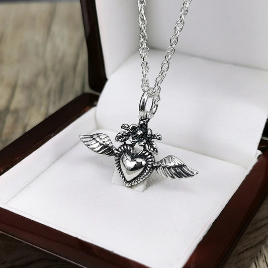 Colgante corazon detente en plata 950